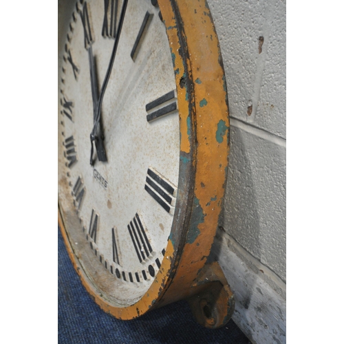 1205 - A GENTS OF LEICESTER CAST IRON WALL CLOCK, mains electric movement, orange painted border with three... 