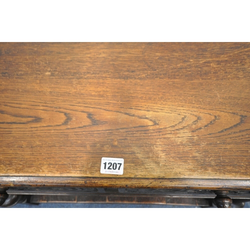 1207 - A REPRODUCTION OAK SIDE TABLE, with two drawers, on turned bulbous legs, united by an undershelf, wi... 