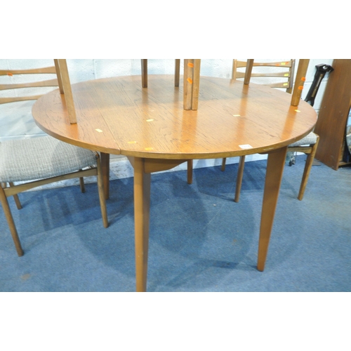 1218 - A MID-CENTURY TEAK CIRCULAR DROP LEAF DINING TABLE, open diameter 114cm x closed width 70cm x height... 