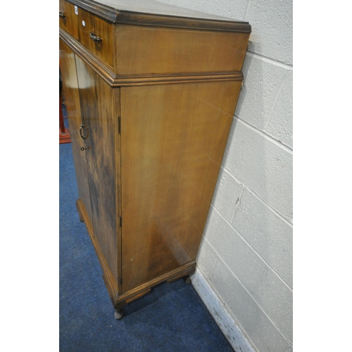 1236 - A 20TH CENTURY WALNUT TALLBOY, fitted with a single drawer above two cupboard doors, that are enclos... 