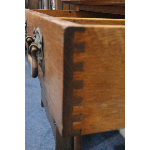 1248 - AN ARTS AND CRAFTS OAK SIDE TABLE, with a green leather inlay, above a single drawer, on cylindrical... 