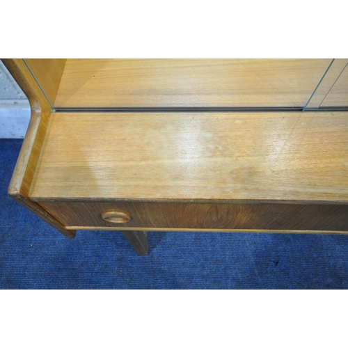 1251 - TURNIDGE OF LONDON, A PAIR OF MID CENTURY TEAK BOOKCASES, with double glazed doors, enclosing a mirr... 