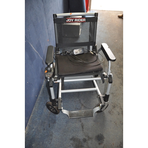 1003 - A JOY RIDER ELECTRIC FOLDING WHEEL CHAIR  with charger (no key required )(PAT pass and working) Cond... 