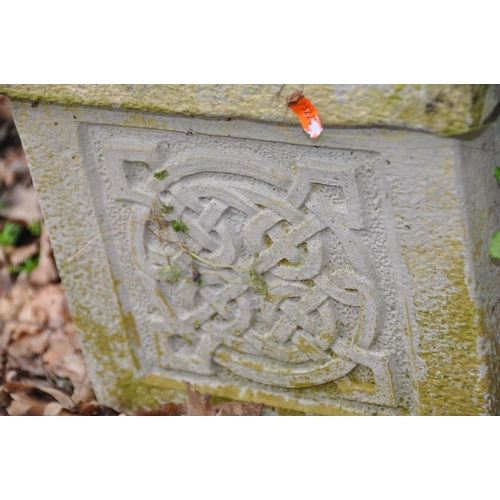 1011 - A PAIR OF MODERN COMPOSITE SQUARE GARDEN PLANTERS with Celtic panels to each face, 31cm cubed