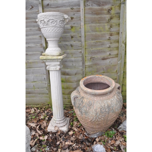 1013 - TWO MODERN COMPOSITE GARDEN URNS the smaller being 36cm high standing on a column total height 119cm... 