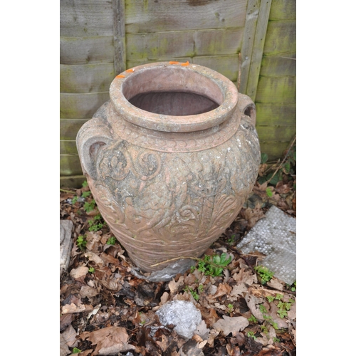 1013 - TWO MODERN COMPOSITE GARDEN URNS the smaller being 36cm high standing on a column total height 119cm... 