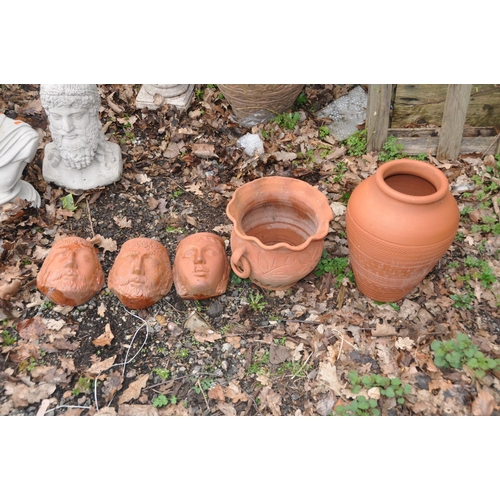 1014 - THREE MODERN TERRACOTTA FACE MASK WALL MOUNTED PLANTERS AND TWO PLANTERS the masks are 19cm high(5)