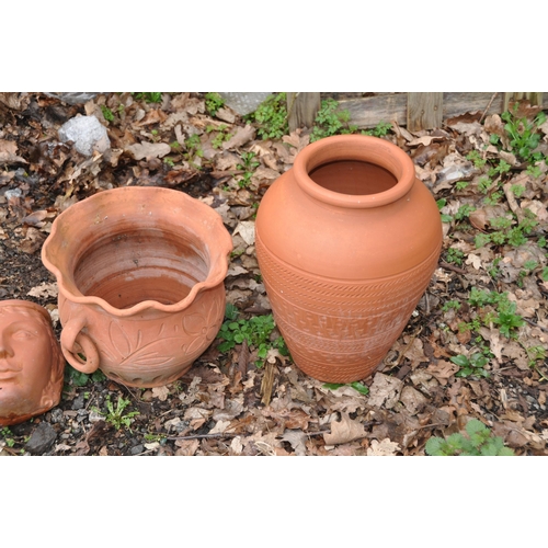 1014 - THREE MODERN TERRACOTTA FACE MASK WALL MOUNTED PLANTERS AND TWO PLANTERS the masks are 19cm high(5)