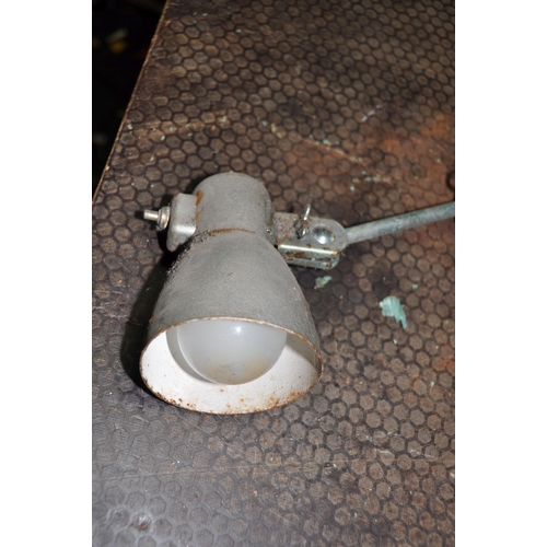 1058 - A VINTAGE INDUSTRIAL ARTICULATED INSPECTION LAMP with textures silver finish, a single joint and adj... 