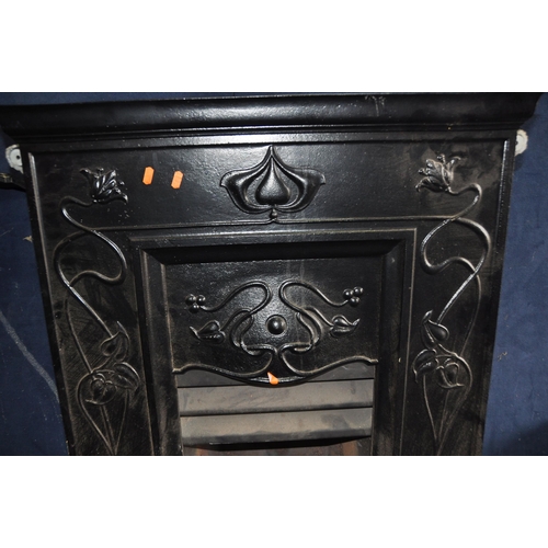 1083 - TWO CAST IRON FIRE INSERTS one with gas fire fittings in Art Nouveau style with a box of 'coals' wid... 