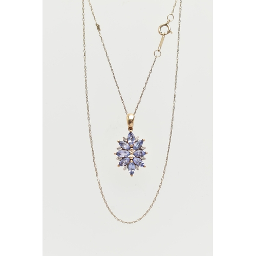 11 - A 9CT GOLD TANZANITE AND DIAMOND PENDANT, designed as a cluster of marquise shape tanzanite with bri... 