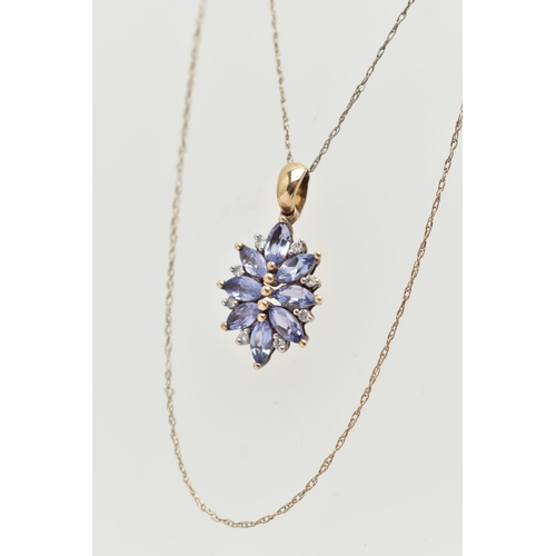 11 - A 9CT GOLD TANZANITE AND DIAMOND PENDANT, designed as a cluster of marquise shape tanzanite with bri... 