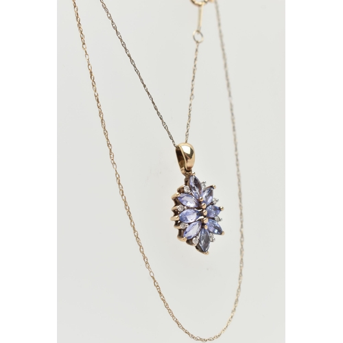 11 - A 9CT GOLD TANZANITE AND DIAMOND PENDANT, designed as a cluster of marquise shape tanzanite with bri... 