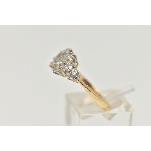 18 - A YELLOW METAL DIAMOND CLUSTER RING, eight old cut diamonds prong set in white metal, approximate to... 