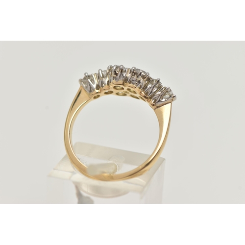 18 - A YELLOW METAL DIAMOND CLUSTER RING, eight old cut diamonds prong set in white metal, approximate to... 