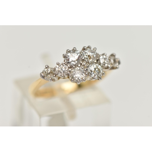 18 - A YELLOW METAL DIAMOND CLUSTER RING, eight old cut diamonds prong set in white metal, approximate to... 