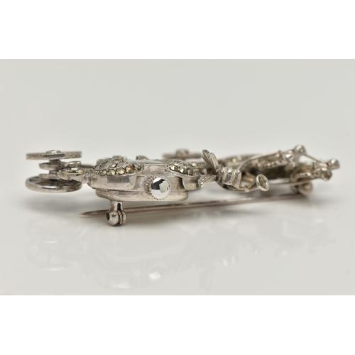 23 - A WHITE METAL WATCH BROOCH, designed as a carriage with a cherub and two horses, set with marcasite,... 