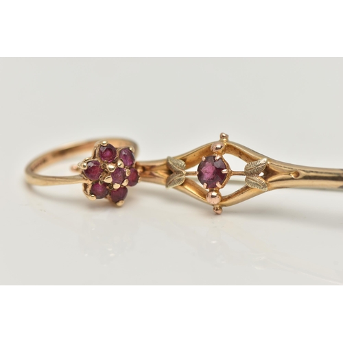 26 - A 9CT GOLD BROOCH AND RING, a principally set round cut garnet, prong set in yellow gold, foliage de... 