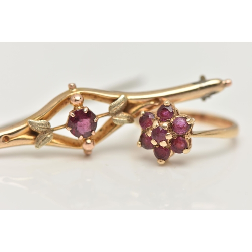 26 - A 9CT GOLD BROOCH AND RING, a principally set round cut garnet, prong set in yellow gold, foliage de... 