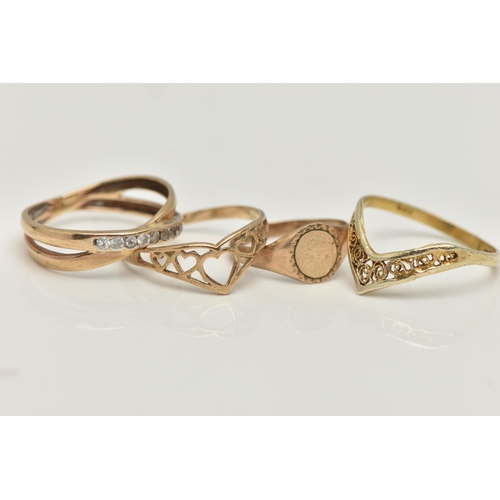 39 - FOUR RINGS, the first a childs 9ct gold oval signet ring, hallmarked 9ct Birmingham, ring size B, ap... 