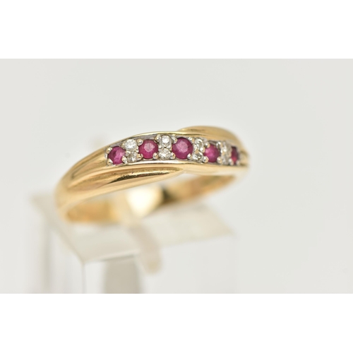 5 - AN 18CT RUBY AND DIAMOND HALF ETERNITY RING, cross over design set with five circular cut rubies int... 