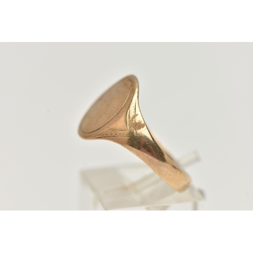 50 - A 9CT YELLOW GOLD SIGNET RING, of an oval form, worn engraving, misshapen shank, hallmarked 9ct Birm... 