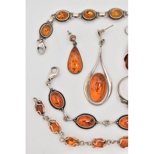 64 - A SELECTION OF AMBER SET JEWELLERY, to include two white metal bracelets set with amber cabochons, f... 