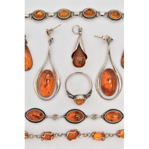 64 - A SELECTION OF AMBER SET JEWELLERY, to include two white metal bracelets set with amber cabochons, f... 