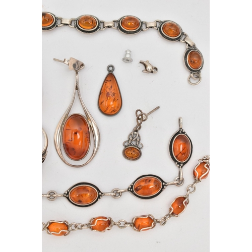 64 - A SELECTION OF AMBER SET JEWELLERY, to include two white metal bracelets set with amber cabochons, f... 