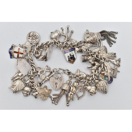 79 - A WHITE METAL CHARM BRACELET, curb link chain unmarked, fitted with a heart padlock clasp, and a lob... 