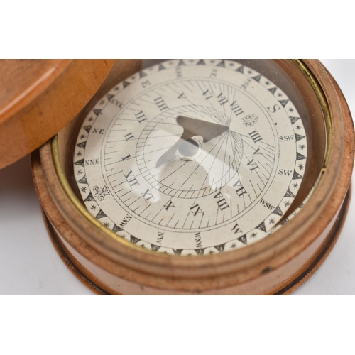 80 - A TREEN POCKET COMPASS, approximate width 54.8mm, instructions label to the base (condition report: ... 