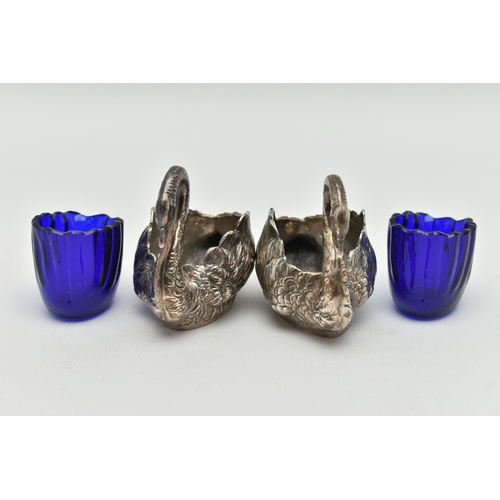 100 - A PAIR OF GEORGE V SILVER NOVELTY SALTS, matching swans with feather detail, with blue glass inserts... 