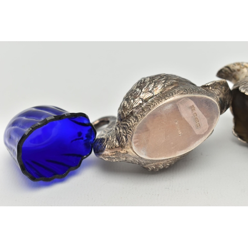 100 - A PAIR OF GEORGE V SILVER NOVELTY SALTS, matching swans with feather detail, with blue glass inserts... 