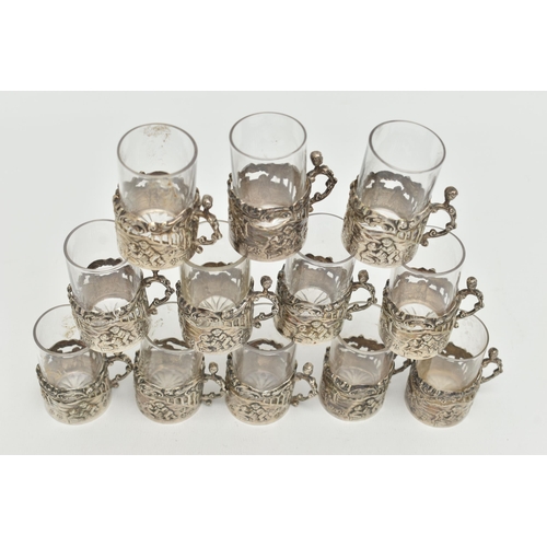 101 - A LATE VICTORIAN SET OF TWELVE LIQUEUR GLASSES, embossed putti scene and acanthus detail, with scrol... 