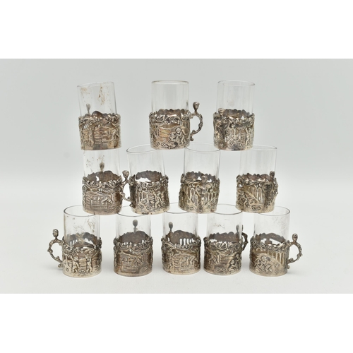 101 - A LATE VICTORIAN SET OF TWELVE LIQUEUR GLASSES, embossed putti scene and acanthus detail, with scrol... 