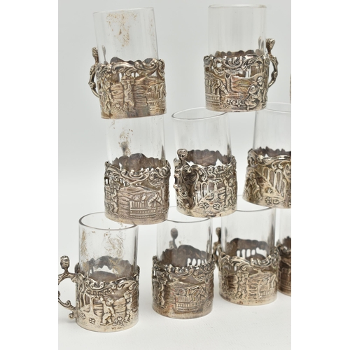 101 - A LATE VICTORIAN SET OF TWELVE LIQUEUR GLASSES, embossed putti scene and acanthus detail, with scrol... 