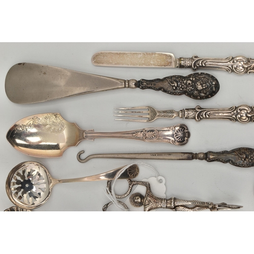 102 - A SELECTION OF SILVERWARE, to include a childrens silver knife and fork set, engraved detail to the ... 