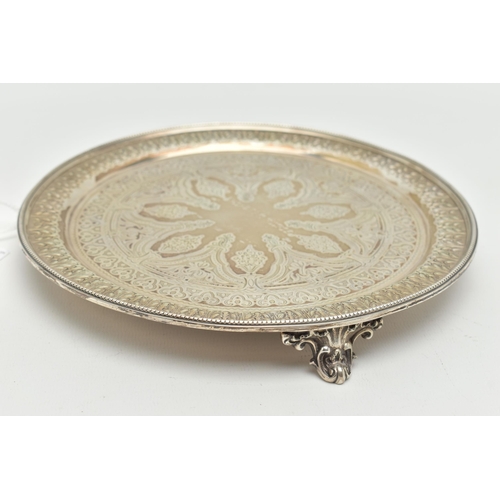 106 - A LATE VICTORIAN SILVER SALVER, circular form, gadrooned border with engraved floral and foliage det... 