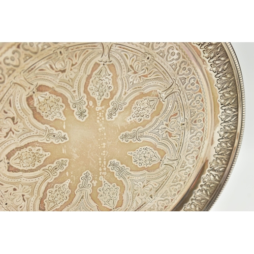 106 - A LATE VICTORIAN SILVER SALVER, circular form, gadrooned border with engraved floral and foliage det... 