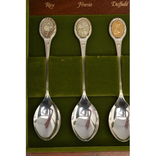 110 - A CASED SILVER SET OF 'THE ROYAL HORTICULTURAL SOCIETY FLOWER SPOONS', wooden box with plaque to the... 