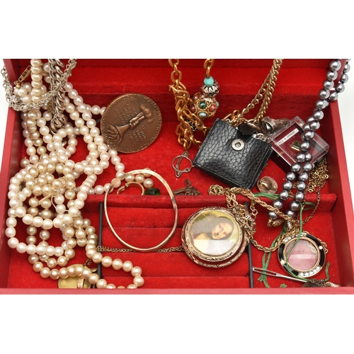 112 - A RED JEWELLERY BOX WITH CONTENTS, to include imitation pearl necklaces, costume chains, novelty Mon... 