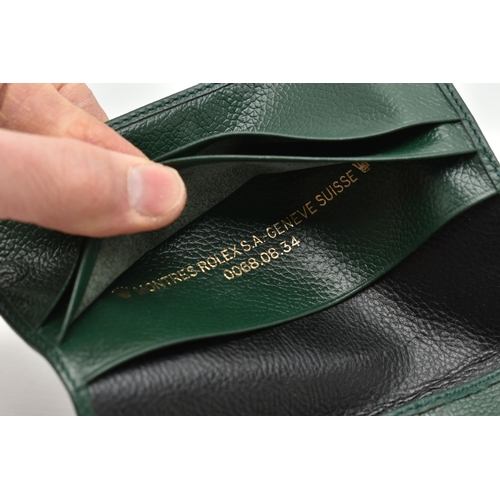 151 - A ROLEX GREEN LEATHER WALLET, various card or reciept compartments to the interior, stamped 'Montres... 