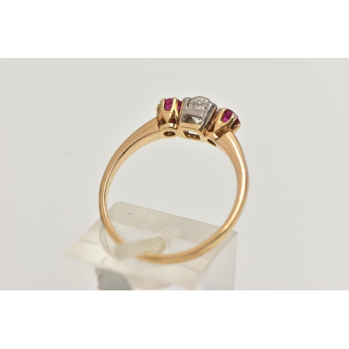 153 - A YELLOW METAL DIAMOND AND RUBY THREE STONE RING, centering on an old cut diamond, estimated diamond... 