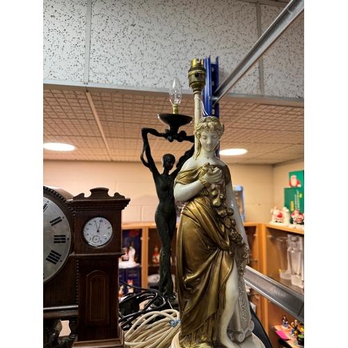 420 - A GROUP OF CLOCKS AND FIGURAL LAMP BASES, comprising a pocket watch and stand, the continental pocke... 