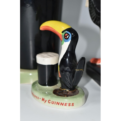 328 - A GROUP OF REPRODUCTION CARLTON WARE STYLE GUINNESS ADVERTISING CERAMICS, comprising a lamp base in ... 