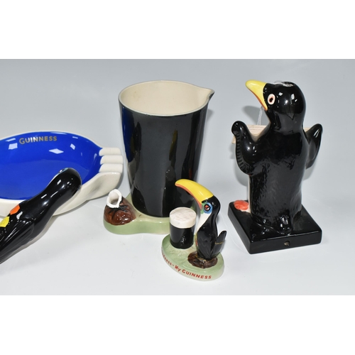 328 - A GROUP OF REPRODUCTION CARLTON WARE STYLE GUINNESS ADVERTISING CERAMICS, comprising a lamp base in ... 