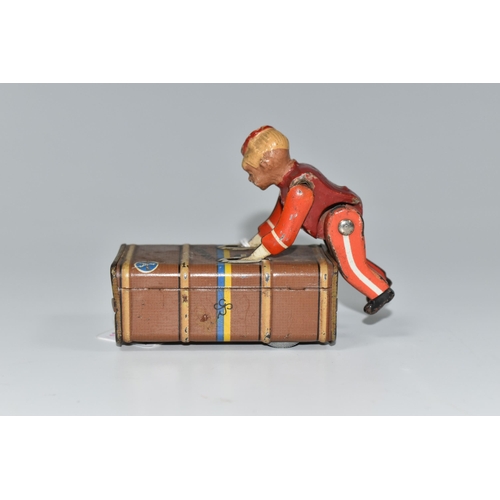 337 - A GESCHA TIN PLATE 'EXPRESS BOY' CLOCKWORK TOY, the boy wearing a red uniform, pushing a trunk, mark... 