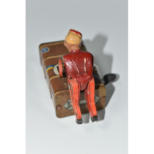 337 - A GESCHA TIN PLATE 'EXPRESS BOY' CLOCKWORK TOY, the boy wearing a red uniform, pushing a trunk, mark... 