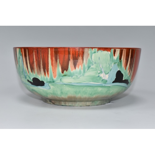 371 - A CLARICE CLIFF 'FOREST GLEN' PATTERN BOWL, painted with a cottage landscape on an orange-red drippe... 