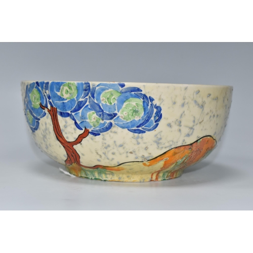 377 - A CLARICE CLIFF PATINA 'BLUE TREE' PATTERN BOWL, painted with blue and green trees in a landscape on... 